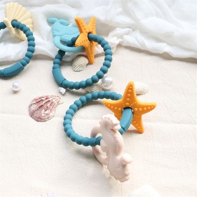 Gıda sınıfı silikon bebek dişleri zehirli olmayan tasarım ve kolay tutma ile BPA ücretsiz silikon diş yüzükleri